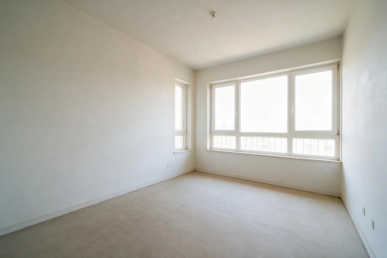 Empty living room with two bright windows before virtual staging